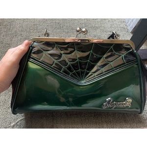 Sourpuss, Forest Green, spider web purse.